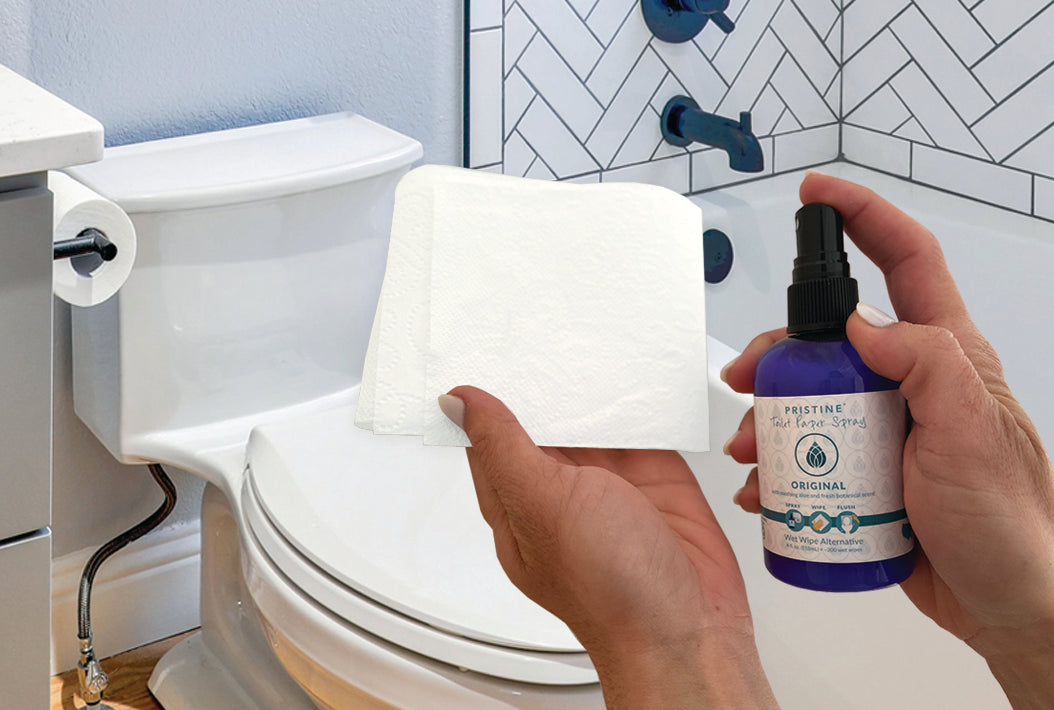 Hands spraying Pristine Toilet Paper Spray onto toilet paper