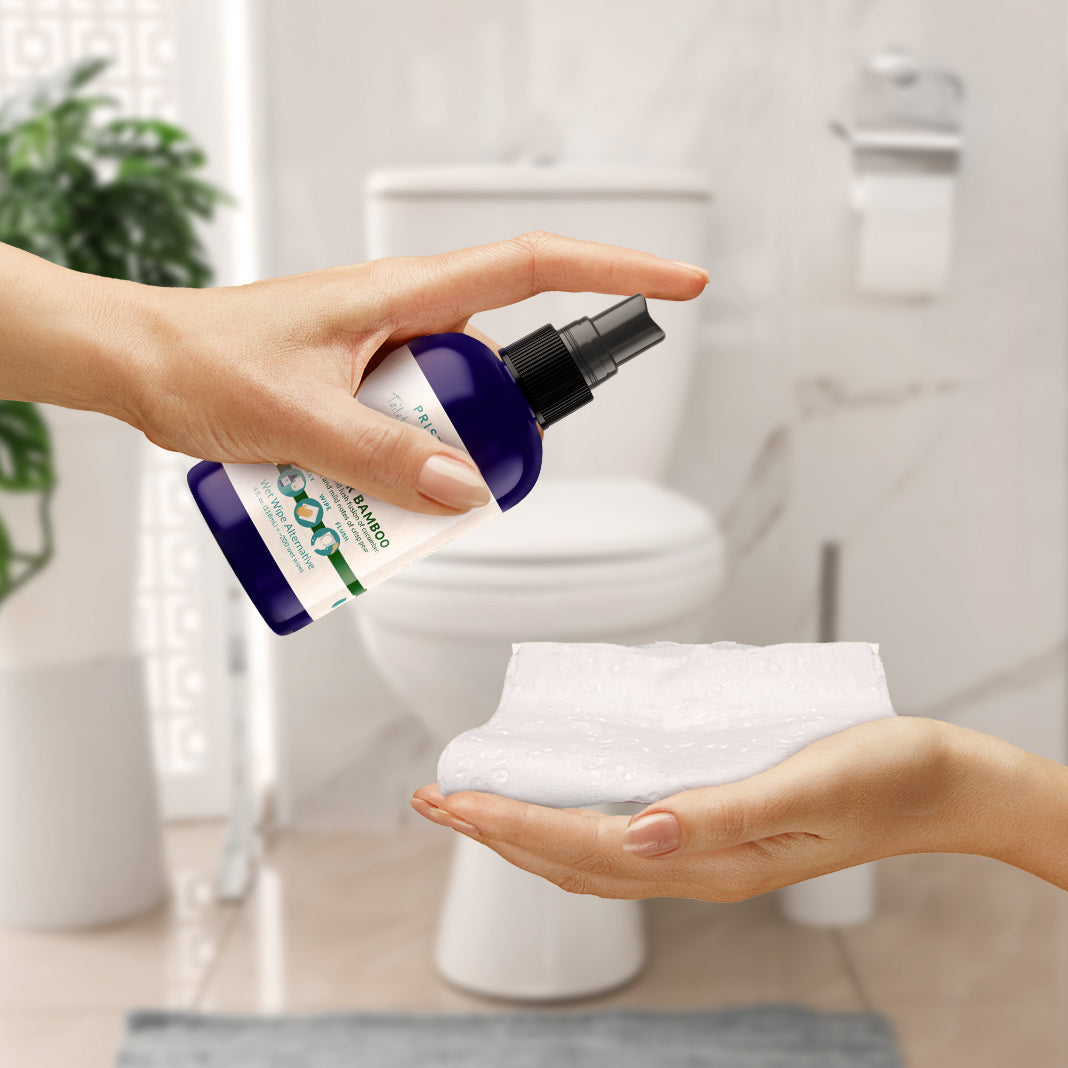 Pristine Toilet Paper Spray being sprayed onto toilet paper.