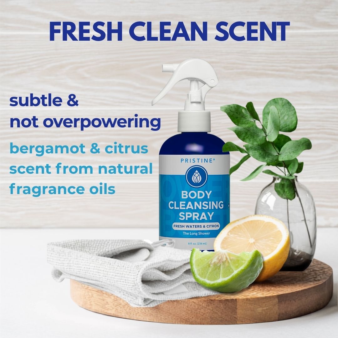 Body cleansing spray bottle with lemons and a plant on a wooden tray, labeled 'Fresh Clean Scent'.