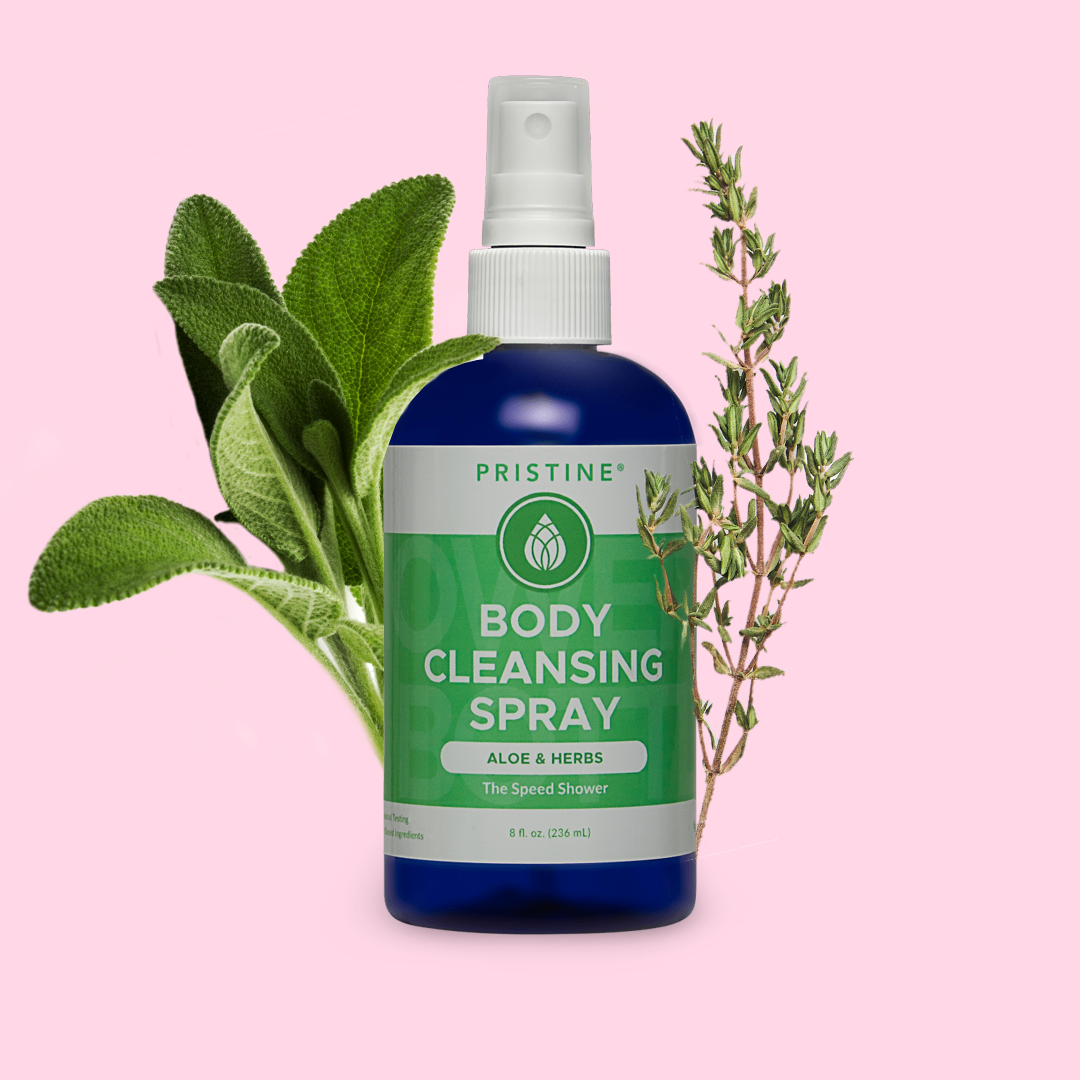 Pristine Body Cleansing Spray Aloe & Herb scent with fresh herbs on pink background.