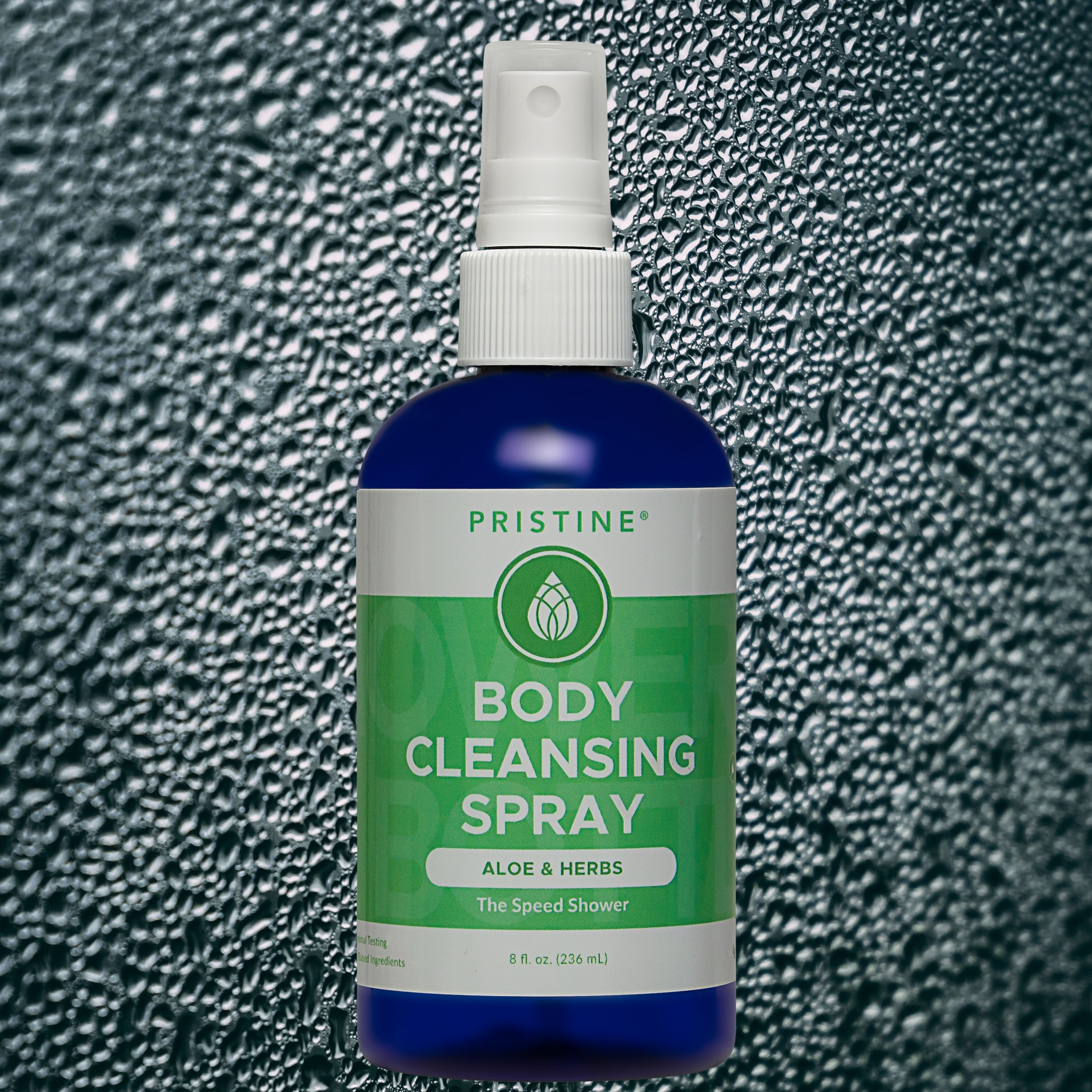 Pristine Body Cleansing Spray mist bottle against wet background with water droplets