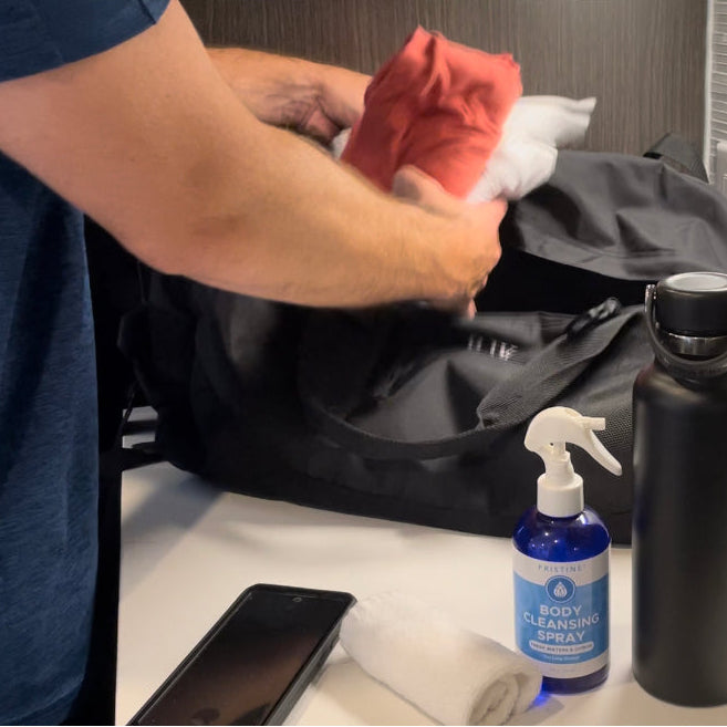 Man packing gym back with Pristine Body Cleansing Spray