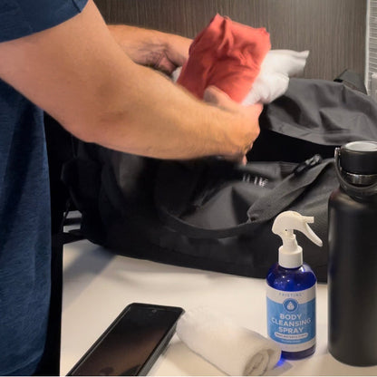 Man packing gym back with Pristine Body Cleansing Spray