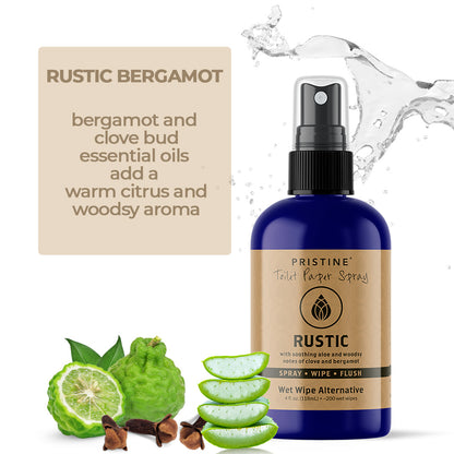 Pristine toilet paper spray wet wipe alternative Rustic spray bottle positioned on barrel with clove bud and bergamot essential oil spices. Graphic states "Rustic Yet Refined. Warm citrus & woodsy clove notes."