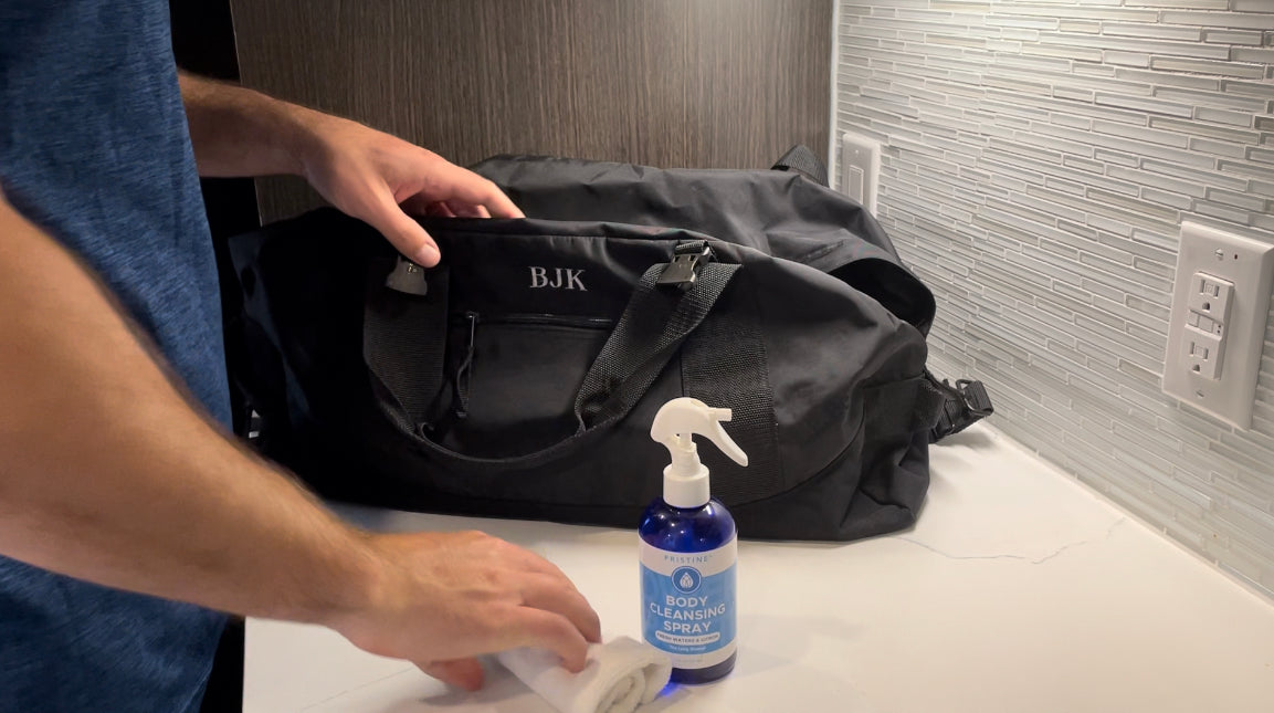 Pristine Body Cleansing Sprays, shower on the go being packed into black gym bag