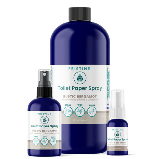 Three bottles of Pristine Toilet Paper Spray on a white background