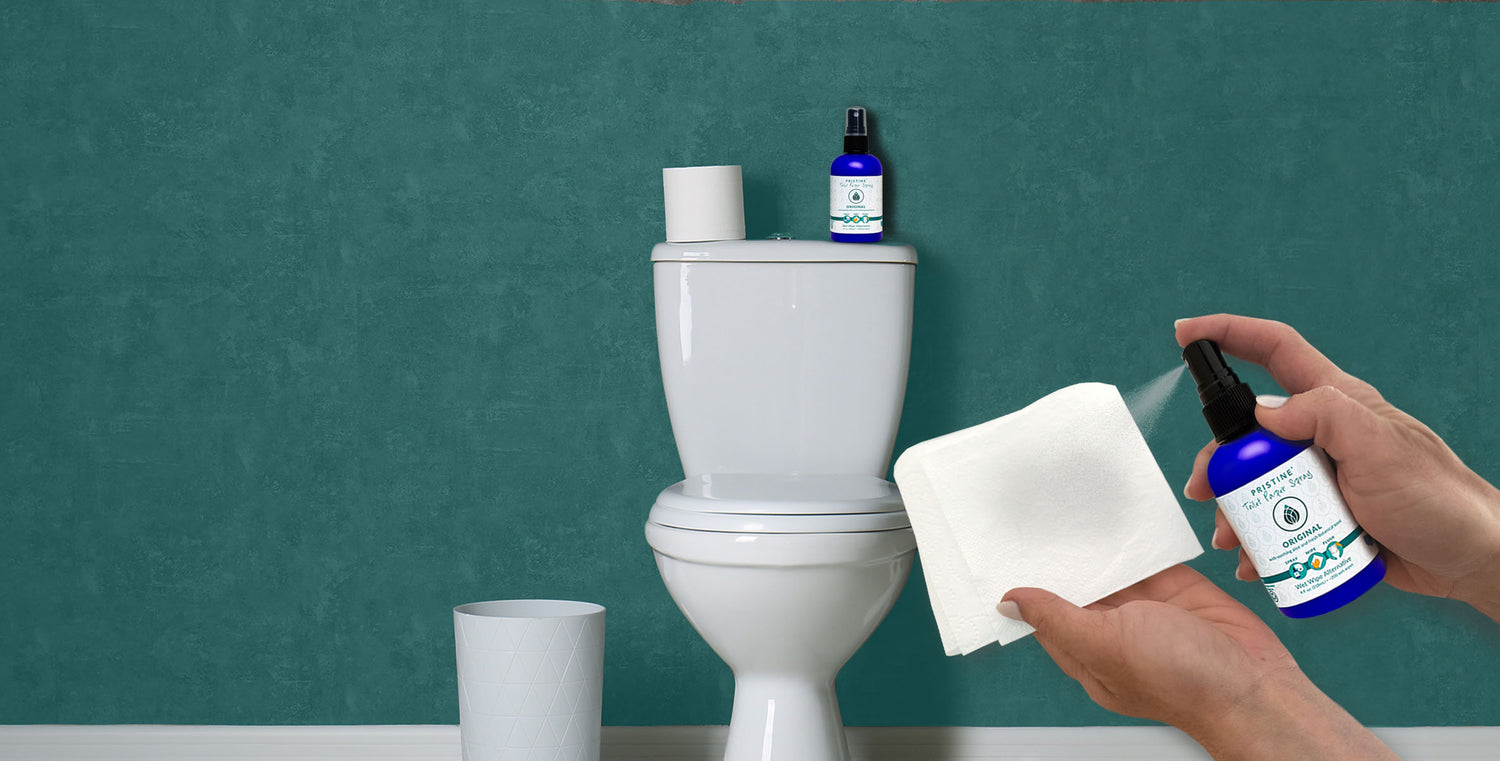 Pristine toilet paper spray wet wipe alternative being sprayed onto toilet paper with toilet in background
