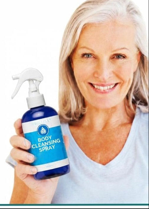 Senior woman holding Pristine Cleansing Sprays bottle with list of plant based and gentle formula