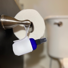 Pristine Pouch holding Toilet paper spray wet wipe alternative on toilet paper holder