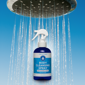 Pristine Body Cleansing Spray bottle underneath shower on blue background.