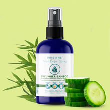 Pristine toilet paper spray 4 oz bottle of cucumber bamboo positioned with cucumbers and green bamboo.