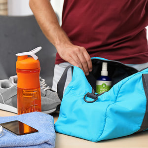 Man standing with gym bag containing Pristine Body Cleansing Spray